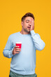 © kegfire - Sleepy man with coffee in morning