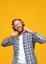 Excited Man Listening To Music And Dancing