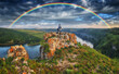 Woman Looking At Rainbow. rainbow over river canyon
