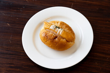 closed up sausage roll , sausage bread (hot dog) sausage bun , soft baked bun stuffed with pork sausage for fast food breakfast or coffee break selective focus.                           