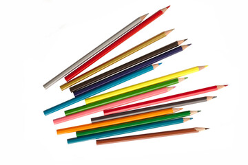 Wall Mural - wooden color pencils arranged in bulk on a white isolated background