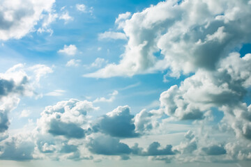 white fluffy clouds against the blue sky. High quality photo