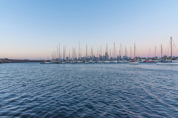 Wall Mural - Sunset view of skyline of Melbourne behind marina at St. Kilda, Australia