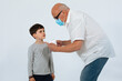 © Fernando - Father and son with face mask studio shoot white background