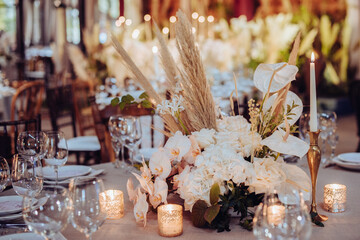 Wall Mural - rustic wedding decorations with flowers and candles. banquet decor. picture with soft focus