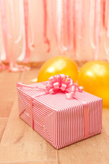 Wall Mural - gift box on pink and golden birthday decorations