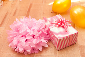 Wall Mural - gift box on pink and golden birthday decorations
