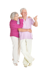 Wall Mural - Senior couple pointing isolated on white background