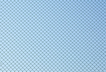 Wall Mural - Wire mesh steel on blue sky background