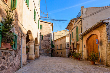 Poster - Colorful street with stone buildings in the old town of Valldemossa, Mallorca island, Spain