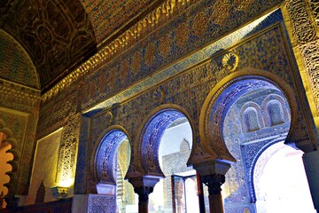 Poster - Architectural details in Mudejar style inside the Alcázar of Seville in Spain. The entire royal palace is a precious historical monument declared a UNESCO World Heritage Site