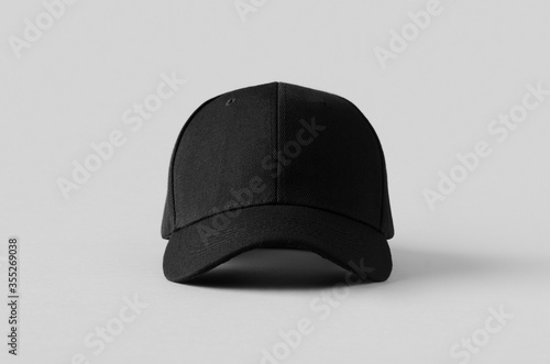 Black baseball cap mockup on a grey background, front view.
