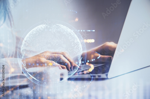 Fotografía Double exposure of woman hands working on computer and world map hologram drawing