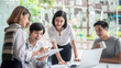 canvas print picture - Young asian modern people in smart casual wear having meeting planning work together as a team and present ideas at work.