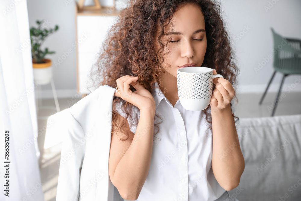 Businesswoman relaxing after work at home