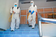 © visoot - Concept good hygienic care in the house,Man in hazmat PPE protective clothing wearing protective mask to Protect Against Covid-19 are cleaning and kill germs in the house.