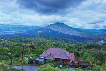 Wall Mural - Unique architectural building whish is the Bali signature with the great Batur Volcano as the background