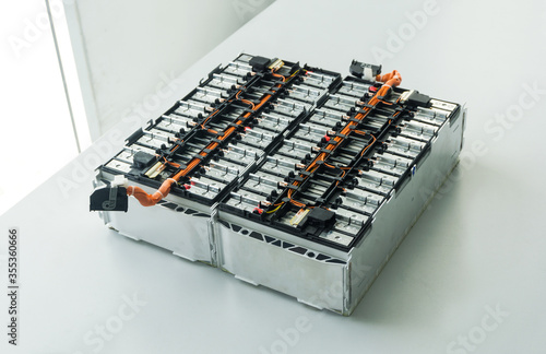 Fotomural Selective focus of Electric car lithium battery pack and wiring connections internal between cells on background