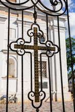 Orthodox Cross Forged In Fence Of Church. Christian Religion Pattern. Entrance To The Temple. Religious Holiday Or Sunday Service.