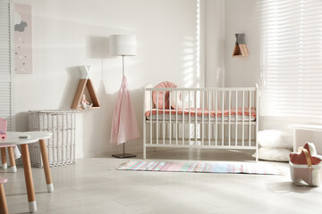 Poster - Cute baby room interior with crib and decor elements