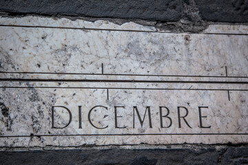 Wall Mural - Zodiac symbol on a mottled granite pavement of the Old square in Bergamo. Lombardy, Italy