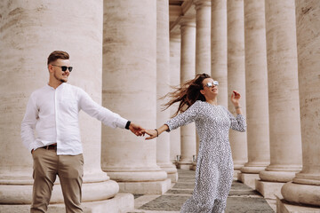 Loving couple at the St. Peter's Square in Vatican