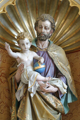 Saint Joseph holding child Jesus, statue in the church of Our Lady of Lourdes and St. Joseph in the Barilovicki Leskovac, Croatia