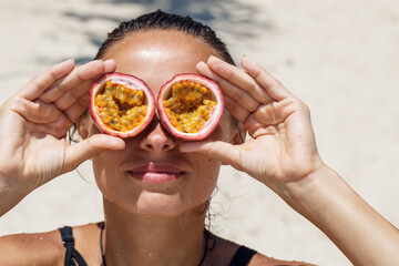 beautiful girl on the beach with passion fruit for eyes