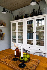 Wall Mural - kitchen in a Scandinavian style. apples and candles a wooden table. 