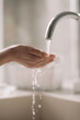 © JustLife - Close up of woman wash her hands.