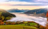 Fototapeta Natura - Incredible Nature Landscape. foggy morning during sunrise at Alpine lake in autumn. Colorful Sky over the Zeller Lake in Zell am See, Salzburger Land, Austria. Creative image. Natural Background
