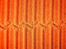 Orange Embossed Stripe Background, Wall Texture, Terracotta Color Seamless Abstract Embossed Surface, 3D Effect.