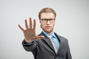 Wall Mural - portrait man businessman showing gesture STOP