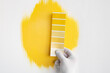 © kegfire - Designer with yellow palette choosing color for wall