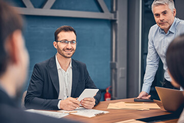 Wall Mural - Co-workers discussing privileges and disadvantages of new contract in office