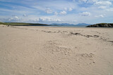 Fototapeta Morze - The beach at Abeffraw with the mountains of Snowdonia National Park in the distance