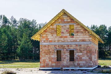 Wall Mural - construction of a small new residential house in a rural area