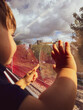 © EZ PHOTOS - One year boy looking on the street thru a train window.