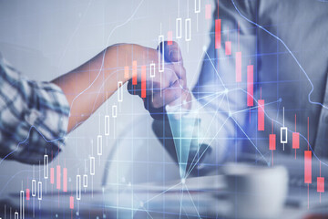 Double exposure of forex graph hologram and handshake of two men. Stock market concept.