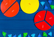 Close up mathematical fractions and colorful letters on blue background. Creative, fun mathematics banner. Education, back to school concept