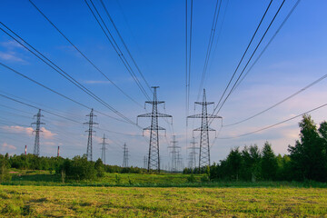 Electricity transmission pylon tower, high voltage power line among the fields.  Distribution station. Supplying cities with electric energy. electricity pole.