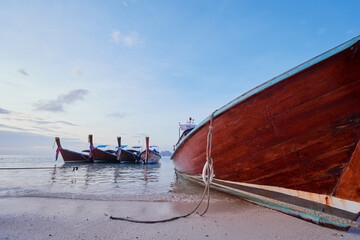 Travel by Thailand. Landscape with traditional longtail fishing boat on the sea beach.