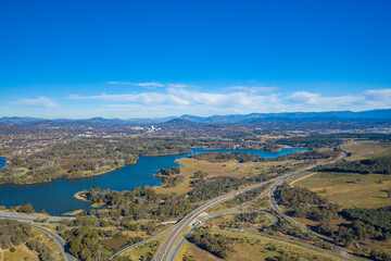 Wall Mural - Aerial panoramic view looking over Glenloch Interchange and Lake Burley Griffin on a sunny day 