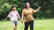 © PK Studio - Grandmother and granddaughter enjoyed in the garden.Asian family conception
