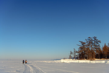 Two male bicyclists on Baikal Lake, Russia