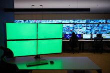 Empty Interior Of Big Modern Security System Control Room With Blank Green Screens