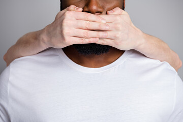 Wall Mural - Please help. Closeup cropped photo of african american guy unfair society shut up black race citizens white skin arm close his mouth danger lawlessness isolated grey color background