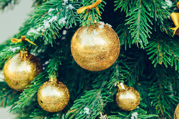 Wall Mural - Green fir tree with golden balls. Christmas wallpaper.