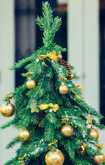 Wall Mural - Green fir tree with golden balls. Christmas wallpaper.