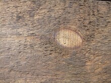 Texture Of Poorly Treated Wooden Board With A Knot